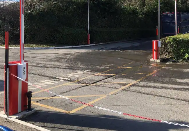Raised red and white barrier on road
