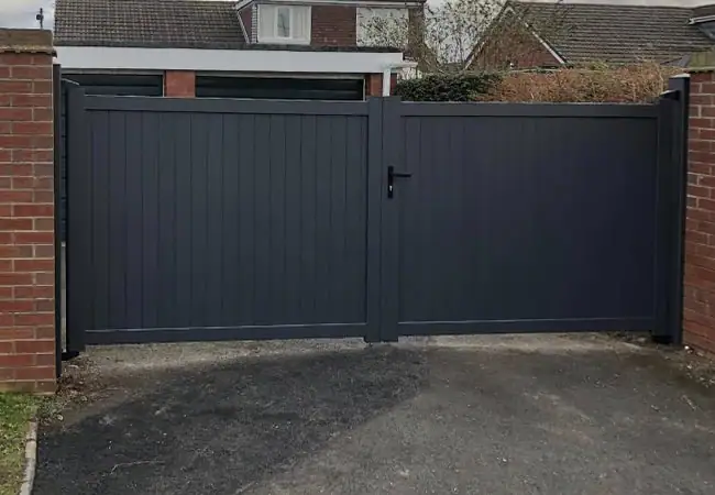 Grey wooden gate on driveway
