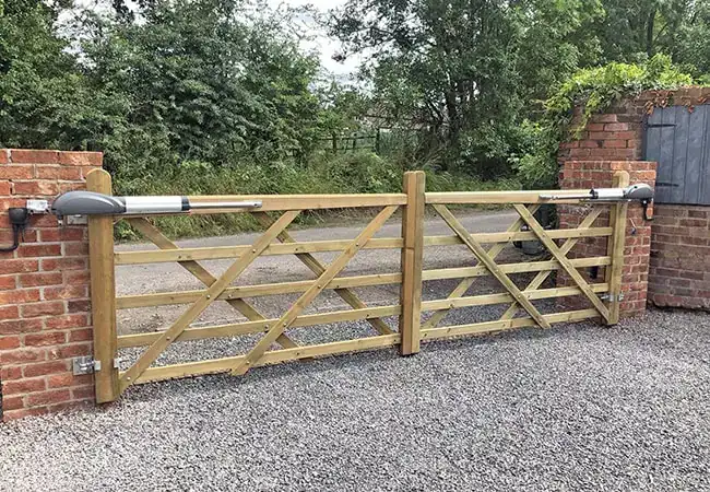 Light brown wooden fence on driveway