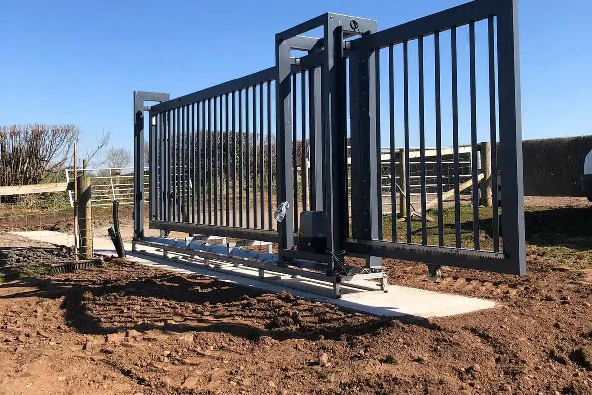 Aluminium sliding gate on a new concrete track at a farm entrance