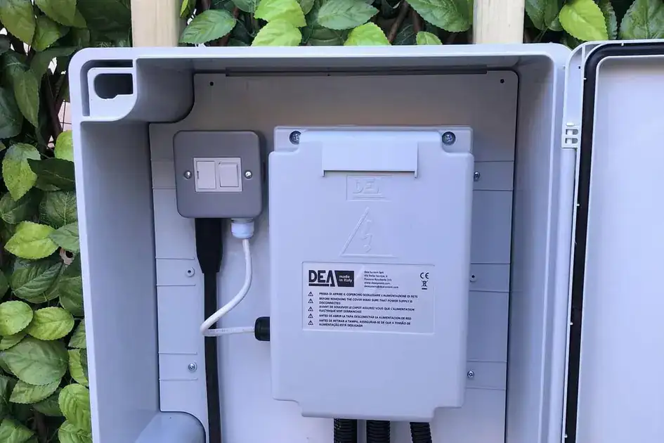 Gate control panel inside an open weatherproof cabinet