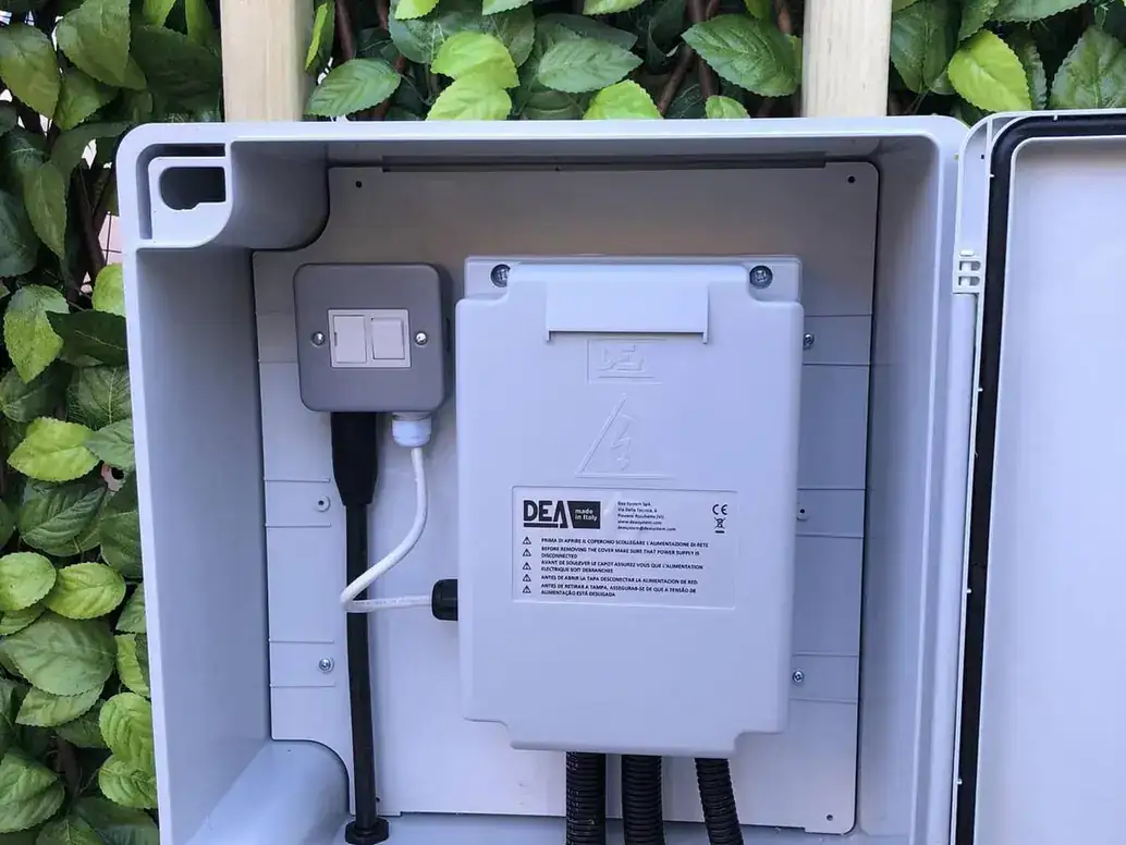 Gate control panel inside an open weatherproof cabinet